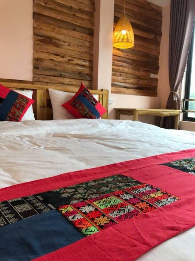 Room with red and indigo textile bed runner